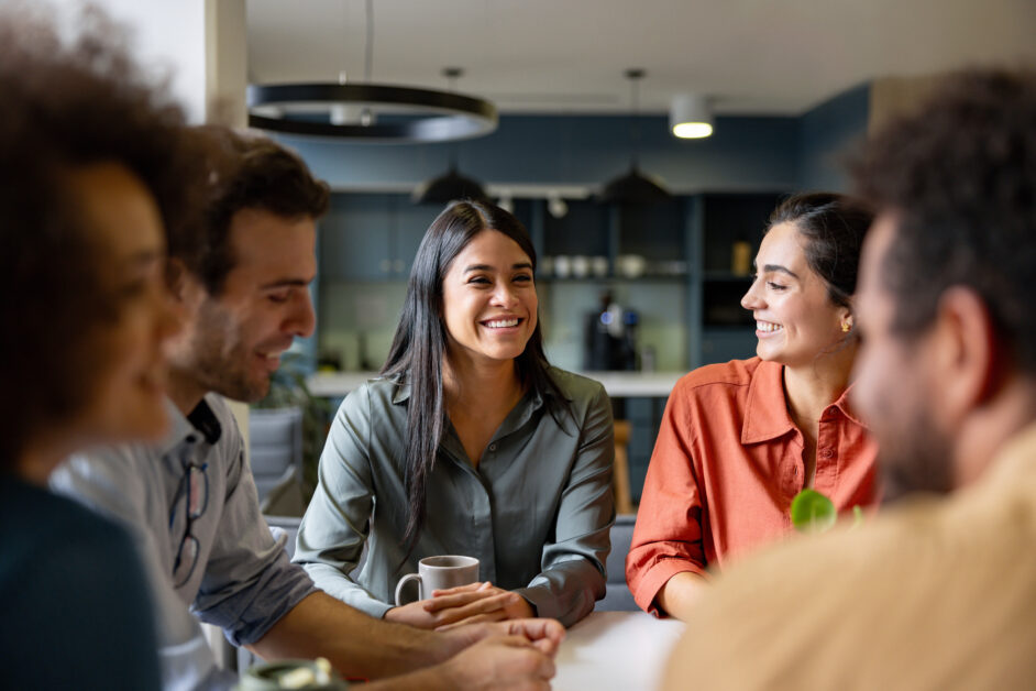 People sitting around a table discussing work