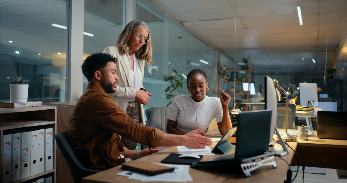 people in an office discussing the best AI tool for HR in 2025