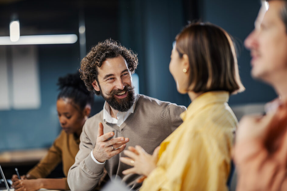 people at work discussing the best investigation software for workplace investigations to leverage at their enterprise org